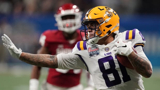 Dec 28, 2019; Atlanta, Georgia, USA; LSU Tigers tight end Thaddeus Moss (81) runs after a pass reception against the Oklahoma Sooners during the second quarter of the 2019 Peach Bowl college football playoff semifinal game. Mandatory Credit: John David Mercer-USA TODAY Sports